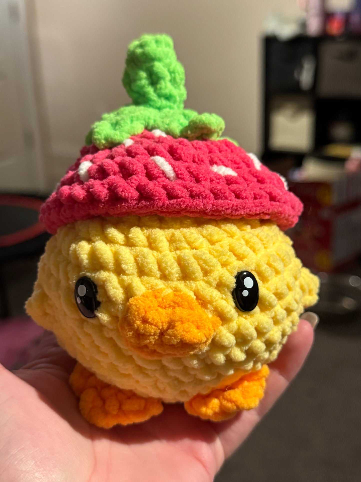 Duck with strawberry hat