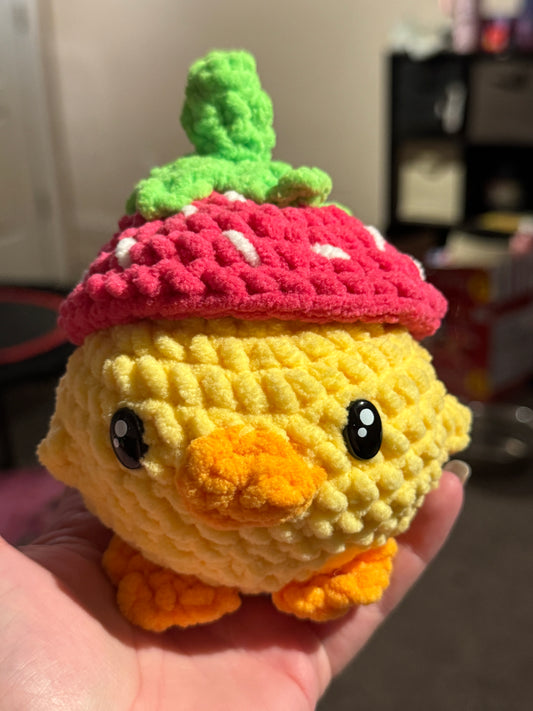 Duck with strawberry hat