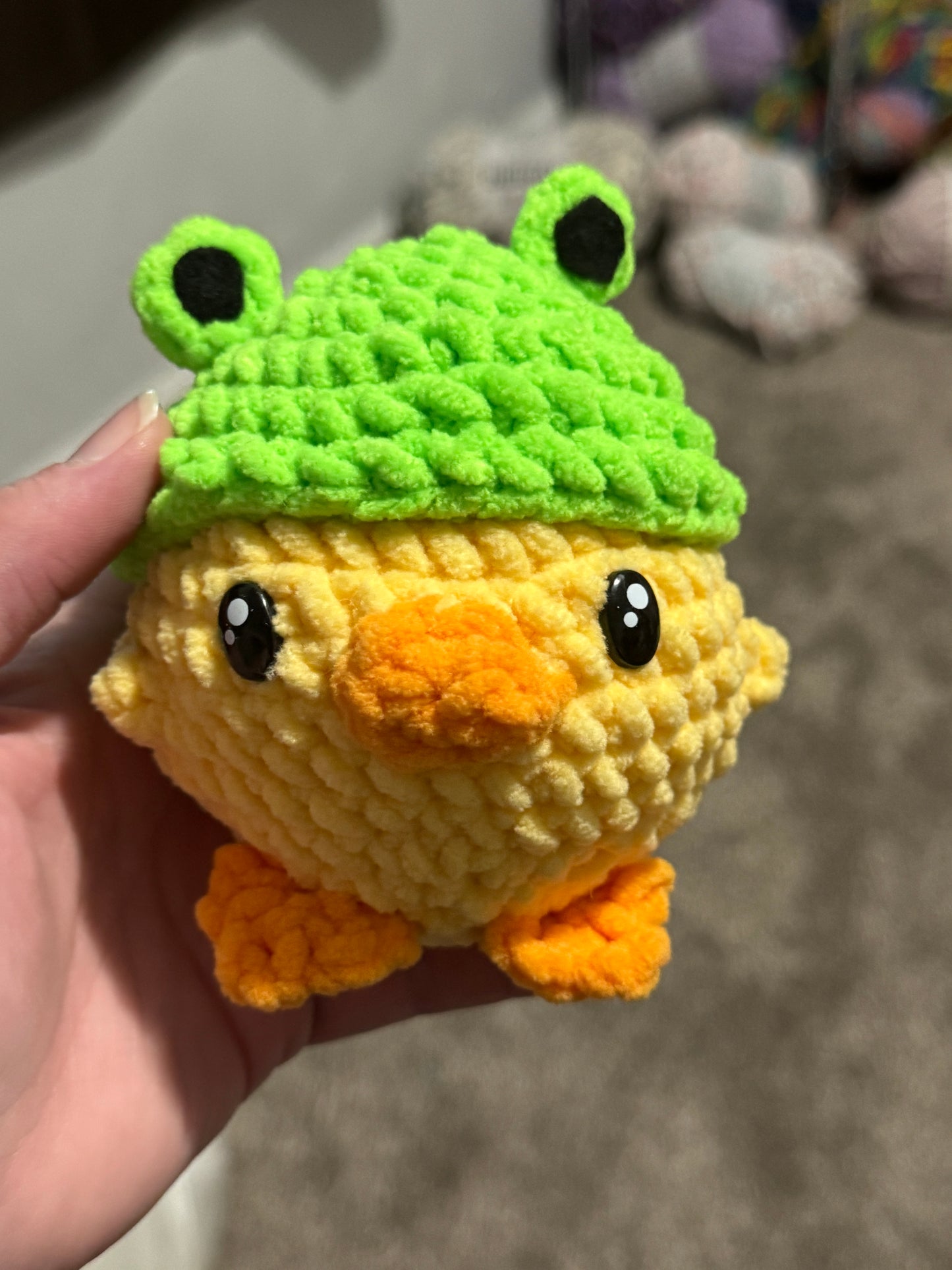 Duck with frog hat
