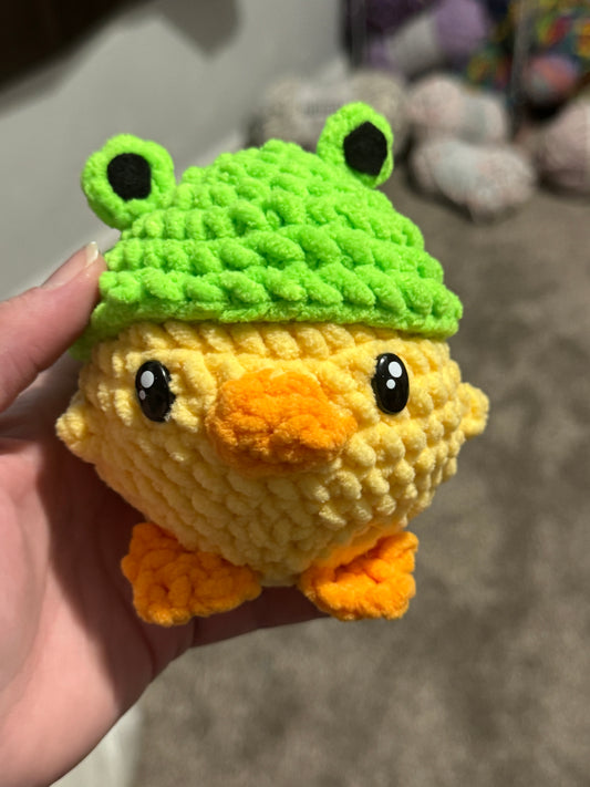 Duck with frog hat